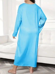 Back view of light blue plus size long sleeve lounge dress with soft draped fabric