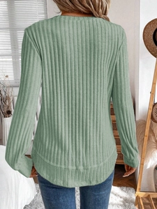 Back view of sage green ribbed knit sweater with curved hem and drop shoulder style