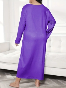 Back view of a loose purple long-sleeve maxi nightgown dress with a dropped shoulder design