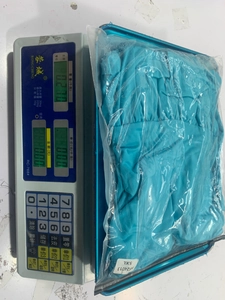 Weight measurement of a plus size 5XL blue sleeveless top in a sealed package