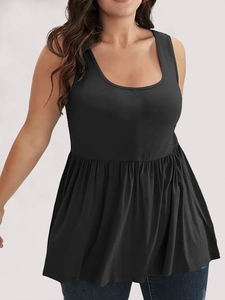 Detail of black sleeveless tunic top with pleated ruffle hem and soft fabric texture