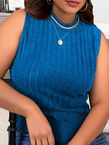 Detail of royal blue rib-knit fabric on a sleeveless mock-neck top for women