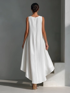 Detailed back view of sleeveless white cotton linen dress with zipper and high-low hem