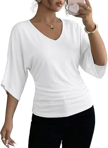 Detailed view of white V-neck top showing waist pleats and soft texture of the fabric