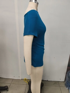 Detail view of the blue ribbed knit fabric and cowl neck design on a slim fit T-shirt