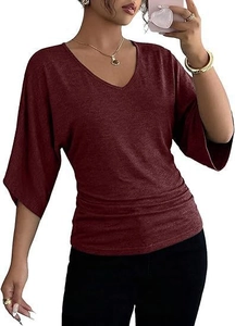 Detail of V-neck dark red top with stylish side ruching and elegant batwing sleeves