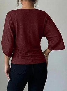 Back view of a burgundy knit V-neck T-shirt with soft texture and half sleeves