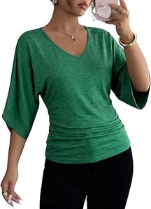 Detail of green V-neck top with ruched side design and textured fabric for women