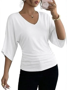 Detail of white V-neck top with stylish side ruching and elegant batwing sleeves
