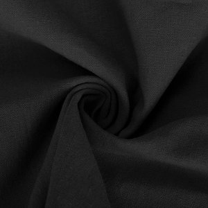 Close-up of high-quality black linen-cotton fabric showing detailed plain weave texture
