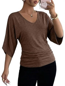 Close-up of brown V-neck top featuring side ruched details and stylish batwing sleeves