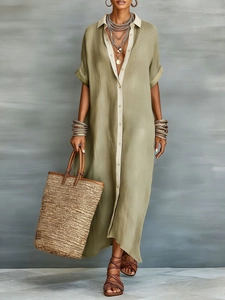 Détail d'une robe longue en lin vert olive avec patte de boutonnage et col contrastés