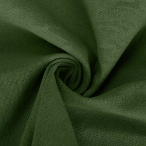 Close-up of deep green linen fabric showing the soft woven texture and draped folds