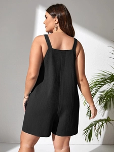 Detailed back view of casual black textured romper with wide straps and square neckline