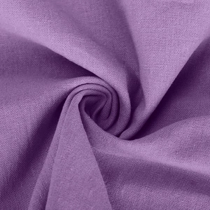 Close-up of dark purple linen fabric showing natural texture and soft draped folds