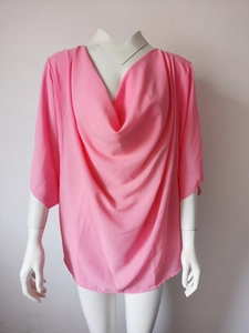 Detail of pink chiffon cowl neck blouse showing textured fabric and draped neckline style