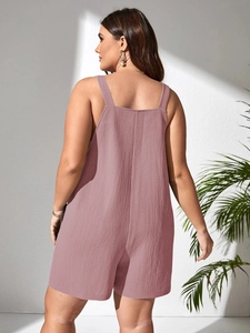 Detail of dusty rose romper with textured crepe fabric and stylish wide shoulder straps