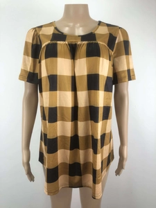 Close-up detail of mustard yellow buffalo plaid pattern and soft pleated texture on top