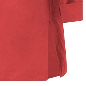 Detail view of red linen cotton top featuring side split and textured woven fabric