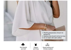 Dettaglio della camicetta in chiffon bianco con tessuto traspirante e resistente alle rughe
