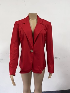 Detail of red blazer showing notch lapel and single gold button closure