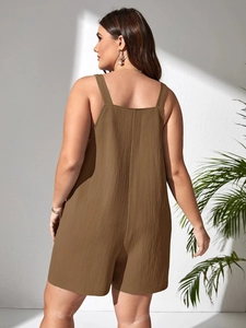 Detail view of the deep olive brown textured fabric and open back design of the jumpsuit