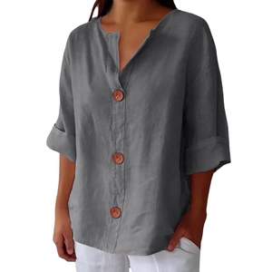 Detail of dark gray linen-cotton top with V-neck and decorative brown buttons
