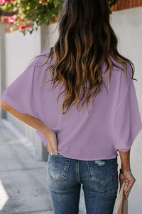 Back view of a lilac chiffon V-neck blouse featuring loose half sleeves and casual fit