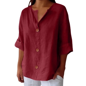 Detail of V-neck opening with three wooden buttons on burgundy linen cotton shirt