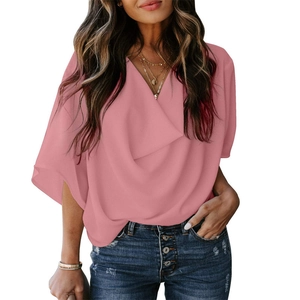 Pink chiffon V-neck top with flutter sleeves shown on a model against white background