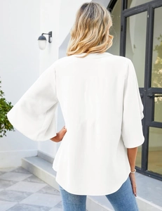 Rear view of white chiffon top featuring loose fit and elegant ruffle flare sleeves