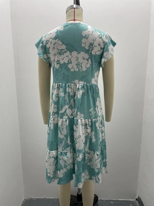 Rear view of floral tiered casual dress with flutter sleeves and ruffled hem layers