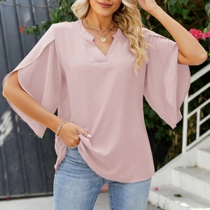 Detail view of pink V-neck chiffon top featuring elegant split ruffle sleeves and tiered edges