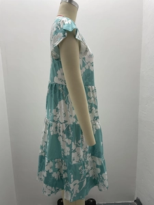 Detail view of the layered ruffle hem on this blue floral sleeveless knit sun dress