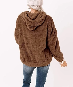 Detail view of brown fleece texture and oversized hood on a cozy winter sweatshirt