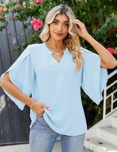 Close-up of light blue chiffon top featuring elegant V-neckline and layered ruffle sleeves