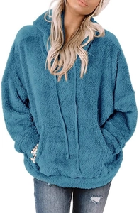 Close-up of soft peacock blue teddy fleece texture and functional kangaroo pocket