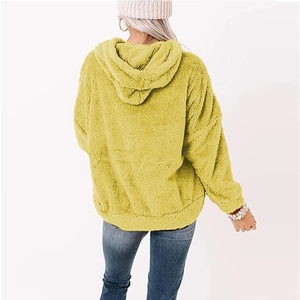 Detail of soft yellow fleece hoodie showing the plush texture and loose back fit