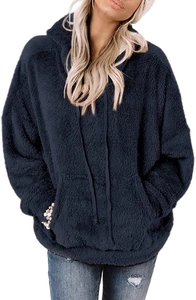 Detail of navy blue oversized hoodie featuring soft polar fleece texture and kangaroo pocket