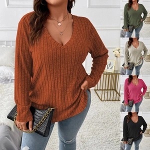 Close-up of ribbed knit texture on a plus size V-neck long sleeve top in multiple colors