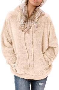 Close-up of fluffy sherpa fabric texture and kangaroo pocket on women hoodie