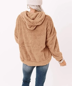Detailed back view of a brown oversized plush fleece hoodie with soft textured fabric