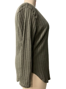 Detail view of olive green ribbed long sleeve shirt with curved hem on mannequin