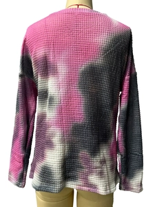 Detailed back view of pink and black tie-dye waffle knit texture on loose fit sweatshirt