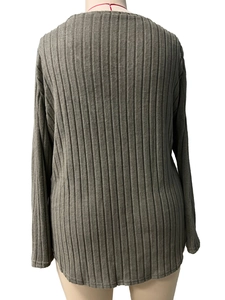 Detail view of olive green ribbed knit fabric and back seam of long sleeve tunic top