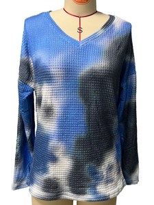 Detail showing V-neck design and waffle knit texture with blue tie-dye pattern on top