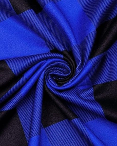 Macro view of blue and black buffalo check fabric with detailed twill weave texture