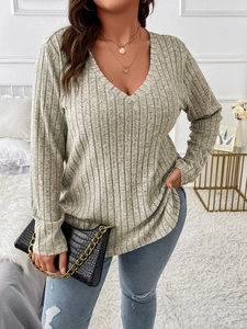Detail shot of grey V-neck ribbed knit top showing soft fabric texture and casual fit