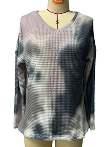 Detail of the tie-dye waffle knit fabric texture on this V-neck long sleeve top