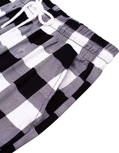 Detail of elastic drawstring waistband and side pocket on black white plaid pants